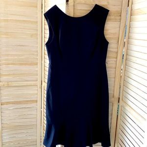 Limited size 12 navy blue dress with tags never been worn ruffle bottom